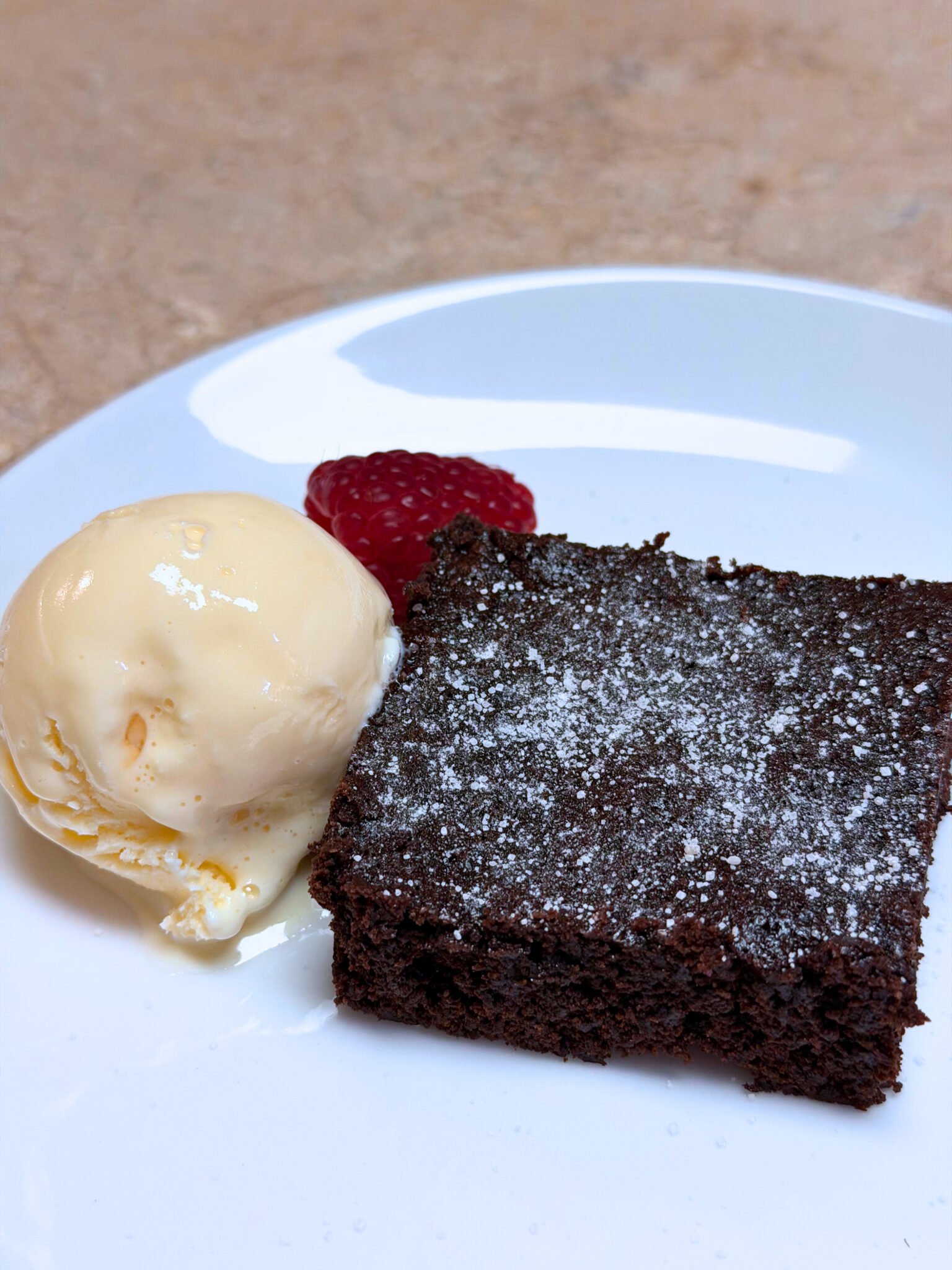 Fudgy homemade brownies better than a box stacked on a plate