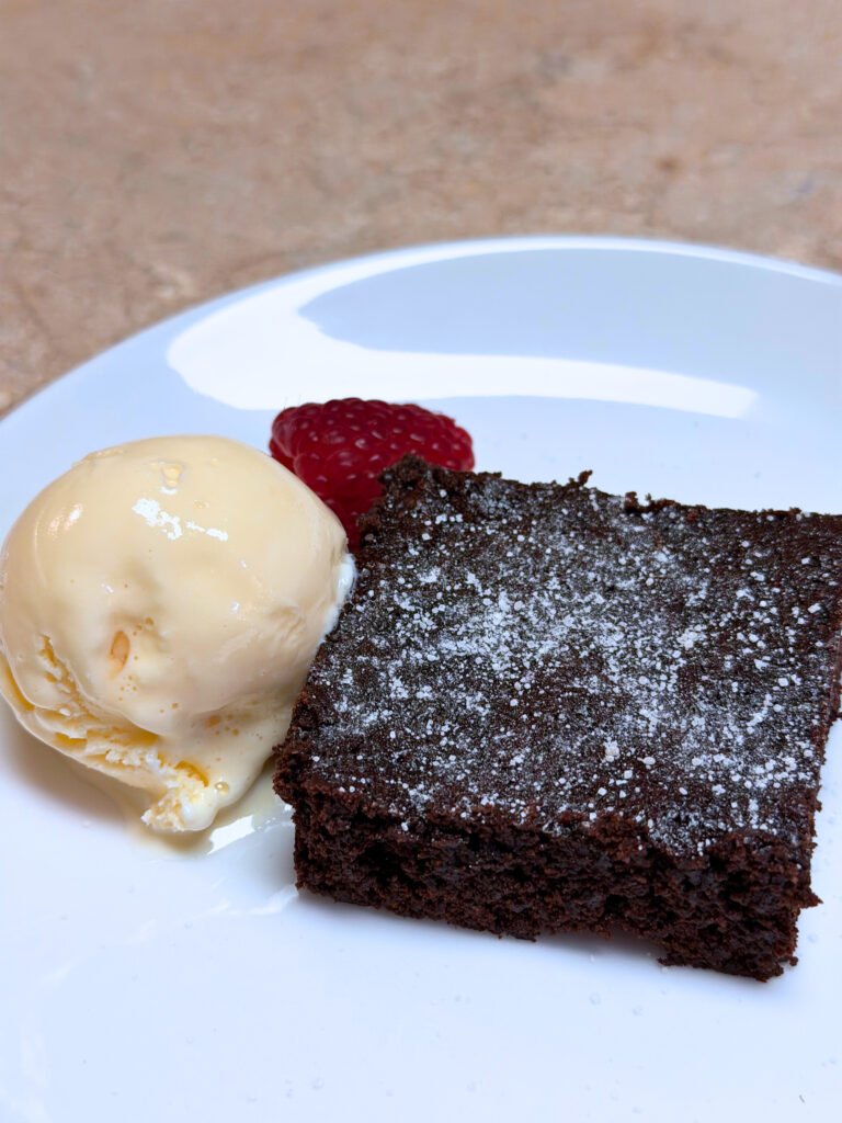 Fudgy homemade brownies better than a box stacked on a plate