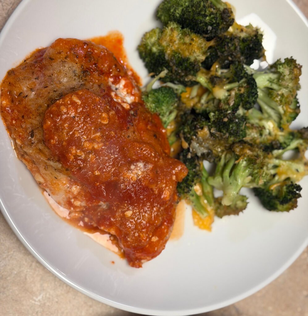 Easy low carb chicken parm casserole fresh out of the oven with bubbly mozzarella