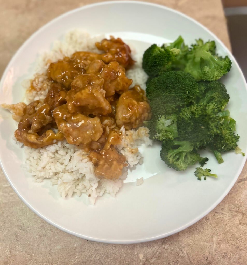 Healthy orange chicken served over steamed rice with broccoli, ready in 30 minutes