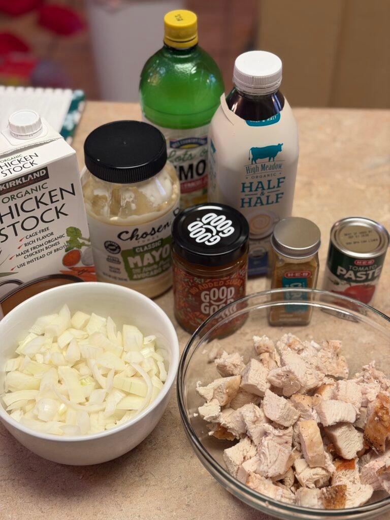 Ingredients for creamy chicken curry: onions, apricot jam, curry powder, and fresh lemon