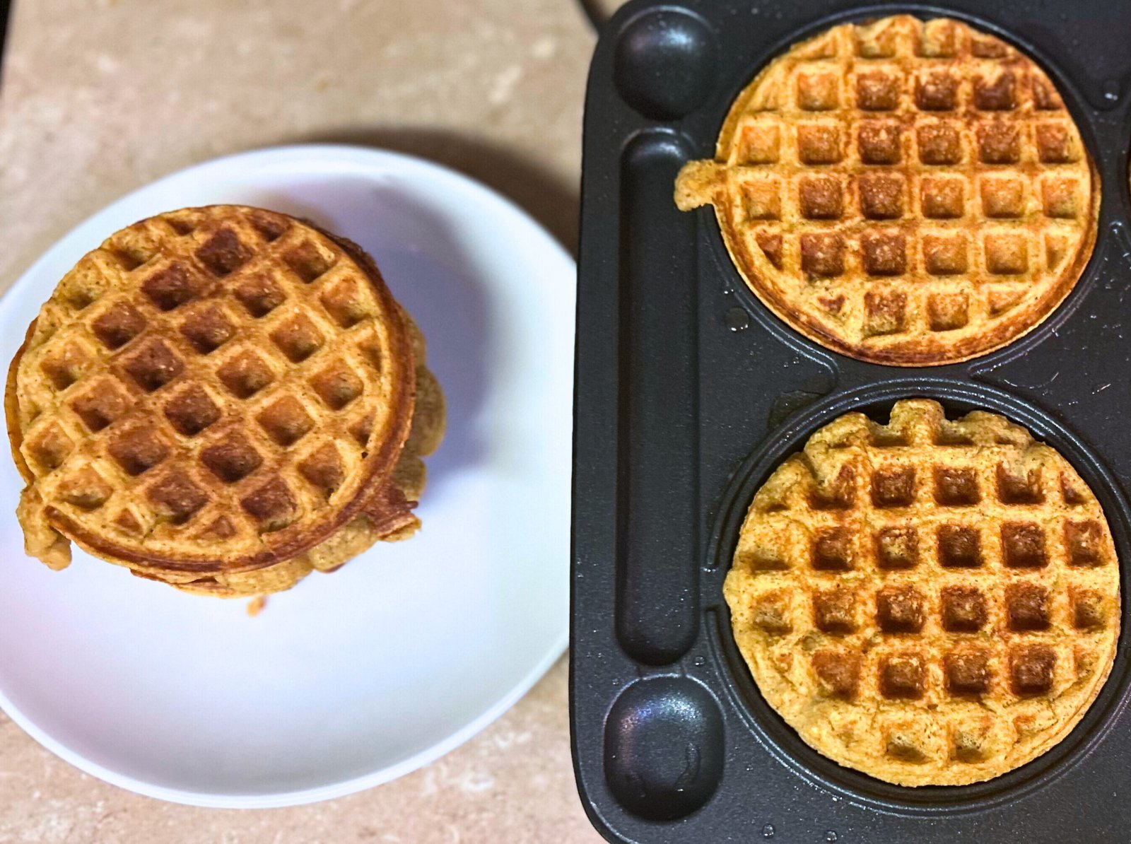 Sweet potato waffle ingredients — oats, sweet potato puree, eggs, milk, and spices laid out on a counter