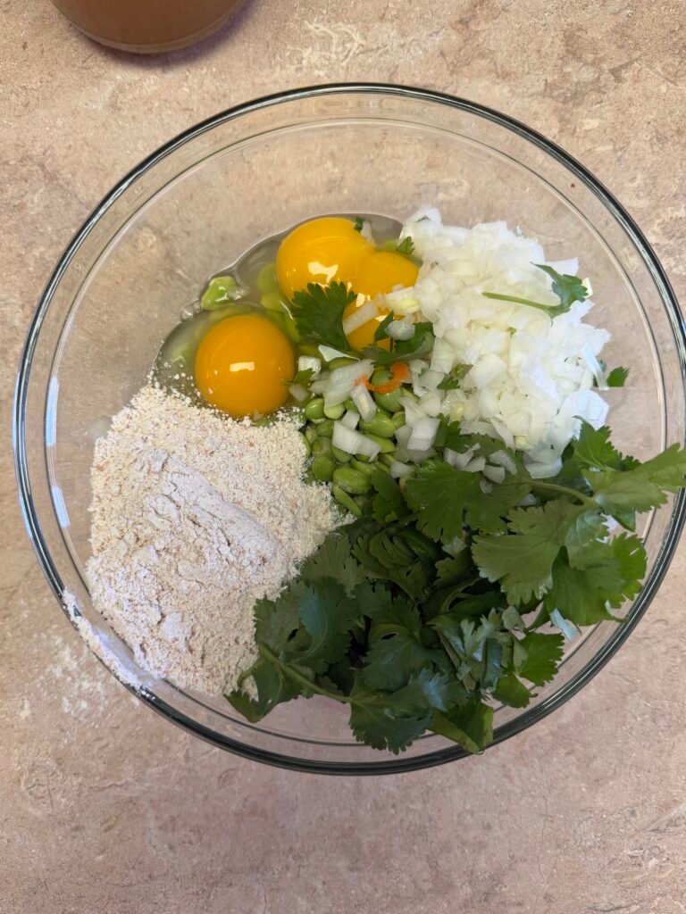 Edamame fritter ingredients: frozen edamame, fresh spinach, eggs, oat flour, and spices